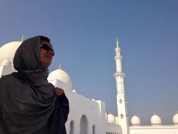 Woman standing outside mosque