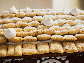 Close-up of cookies on gingerbread house at home