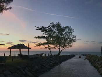 Scenic view of sea against sky at sunset