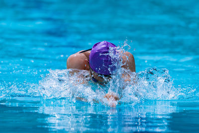 Man swimming in pool
