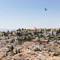 Aerial view of townscape against clear sky