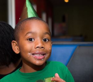 Portrait of boy smiling indoors