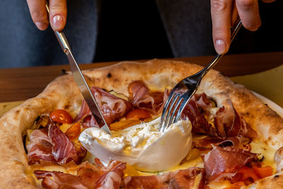  a pizza with the finest parma ham and organic mozzarella or buratta baked in a wood-fired oven