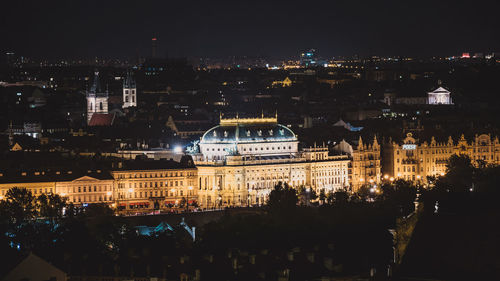 High angle view of illuminated buildings in city at night