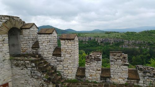 Old ruin building against cloudy sky