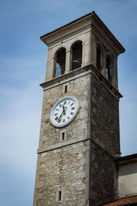 Low angle view of clock tower against sky