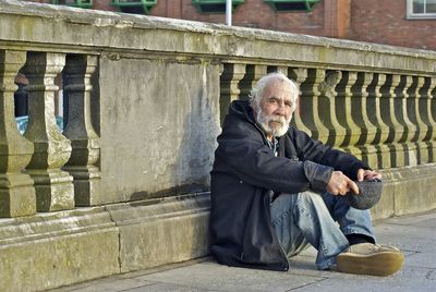 Portrait of man sitting outdoors