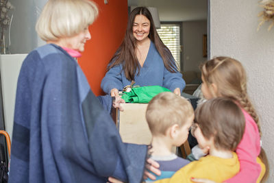 Woman gives ukrainian refugee clothes and toys to support them because of the russian attack