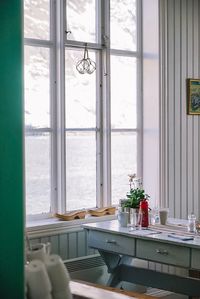 Potted plant on window sill at home