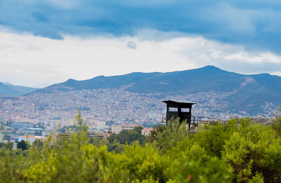 Scenic view of mountains against cloudy sky