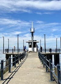 Pier over sea against sky