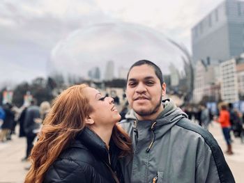 Portrait of young couple in city