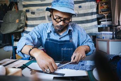 High angle view of man working on table