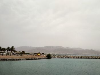 Scenic view of bay against sky