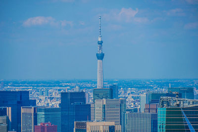 Buildings in city against sky