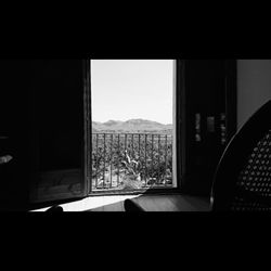 View of mountains through window