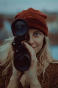 Portrait of woman photographing