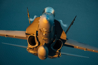 Aerial view of airplane flying over sea