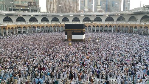 High angle view of group of people in front of building