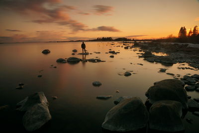 Scenic view of lake against sky during sunset