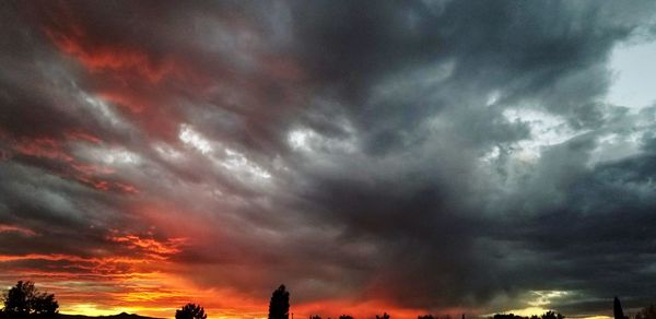 Low angle view of dramatic sky during sunset