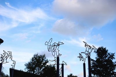 Low angle view of statue against cloudy sky