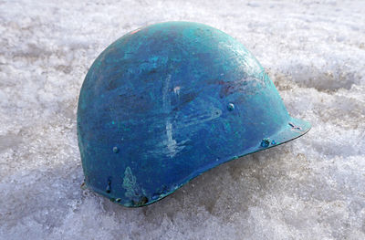 Close-up of blue umbrella on concrete