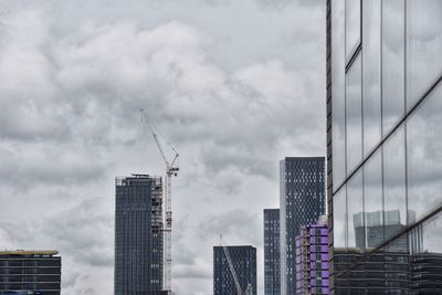 Modern buildings against sky in city