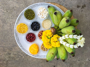 High angle of religious offering plate of food