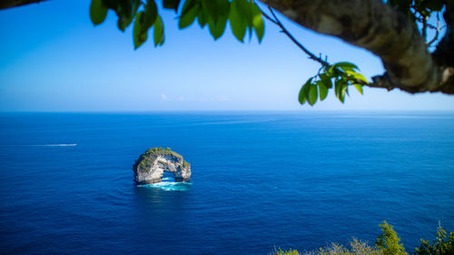 Scenic view of sea against blue sky