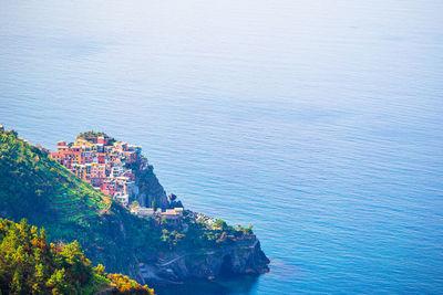 High angle view of townscape by sea