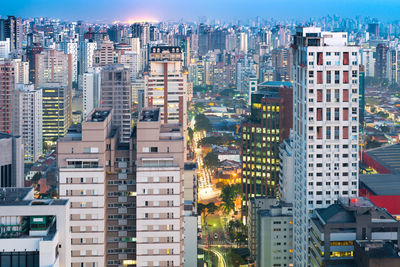 High angle view of buildings in city against sky