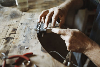 Cropped image of craftsman working in workshop
