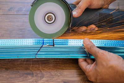 Cropped hand of man working at table