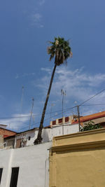 Low angle view of built structure against blue sky