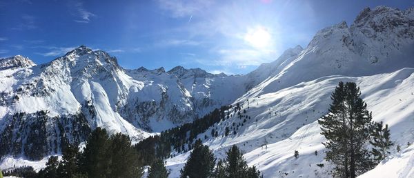 Panoramic view of snowcapped mountains against sky