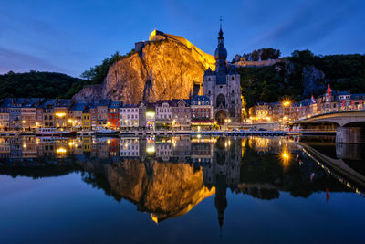 Reflection of illuminated buildings in lake