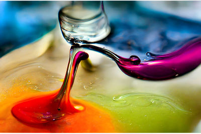 Transparent colorful oil drops closeup abstract background, neural network generated art