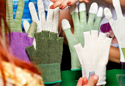 Close-up of hand holding glove