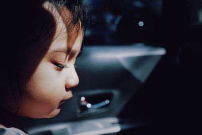 Close-up portrait of girl using mobile phone