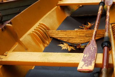 High angle view of yellow and leaves on wood