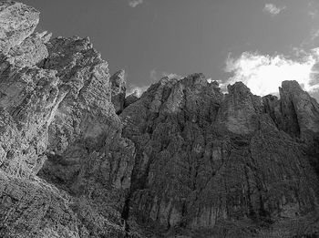 Low angle view of rock formation against sky