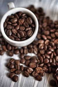 Close-up of roasted coffee beans on table