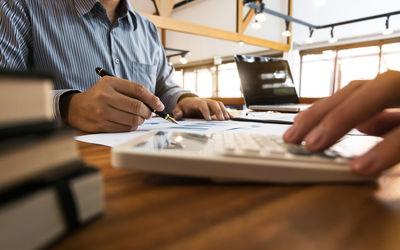 Close-up of man working on table