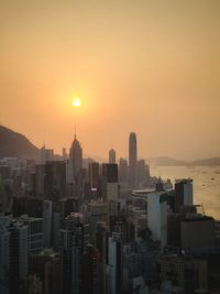 Modern buildings against romantic sky at sunset