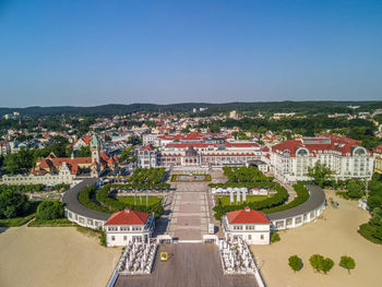 High angle view of townscape against blue sky