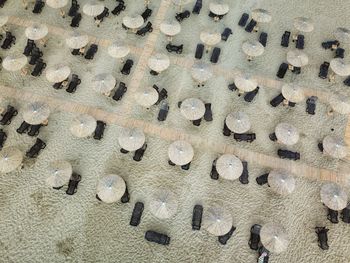 Aerial view of thatched roofs on beach