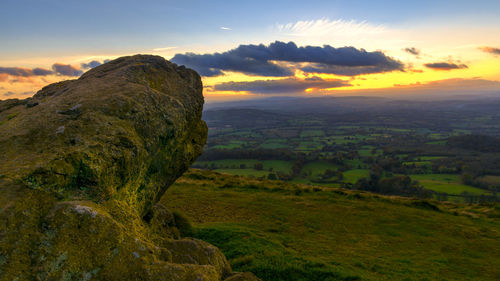 Scenic view of landscape against sky during sunset