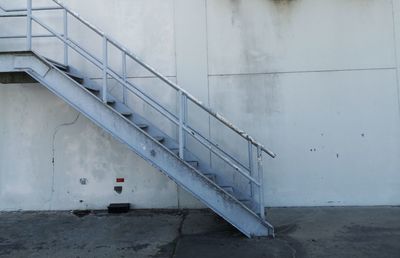 Staircase by building against wall