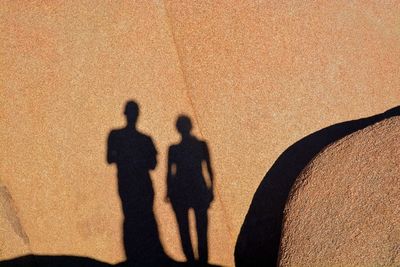 Shadow of people on street